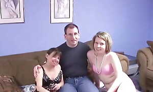 Nerdy pervert gets lucky and fucks two lingerie babes in bed